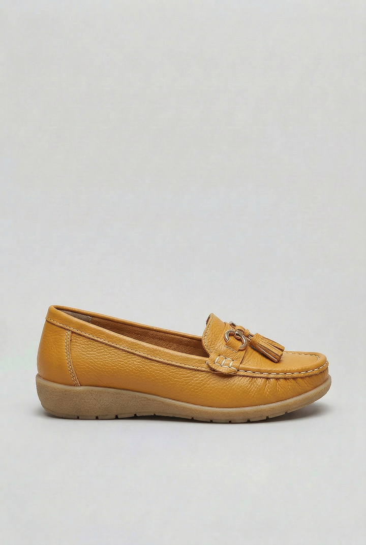 Detailed stitching on classic women's slip-on loafers, adding to their premium everyday fashion appeal.