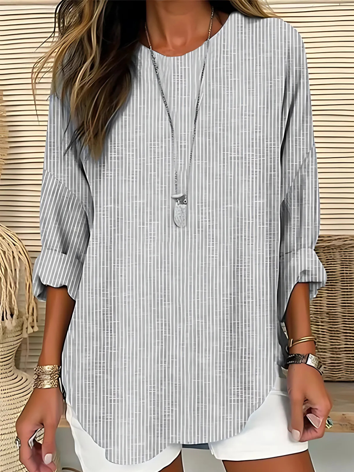 Stylish grey striped women's blouse, long sleeve, relaxed fit. Ideal for versatile everyday spring, summer, autumn wear.