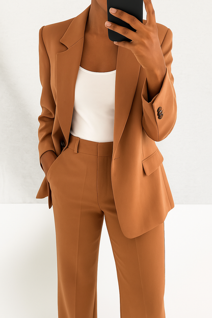 Professional Women's Two-Piece Outfit: Sharp blazer and pants for a polished, elegant office look.