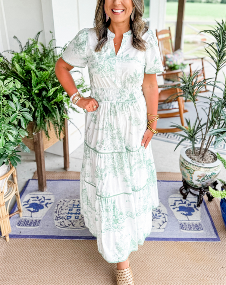 Woman moving in a long, flowing Toile Maxi Dress, emphasizing its elegant movement for summer events.