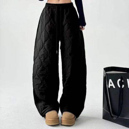 Women's Cloudline quilted trousers in a relaxed, wide-leg fit, perfect for cozy chic style & comfort.