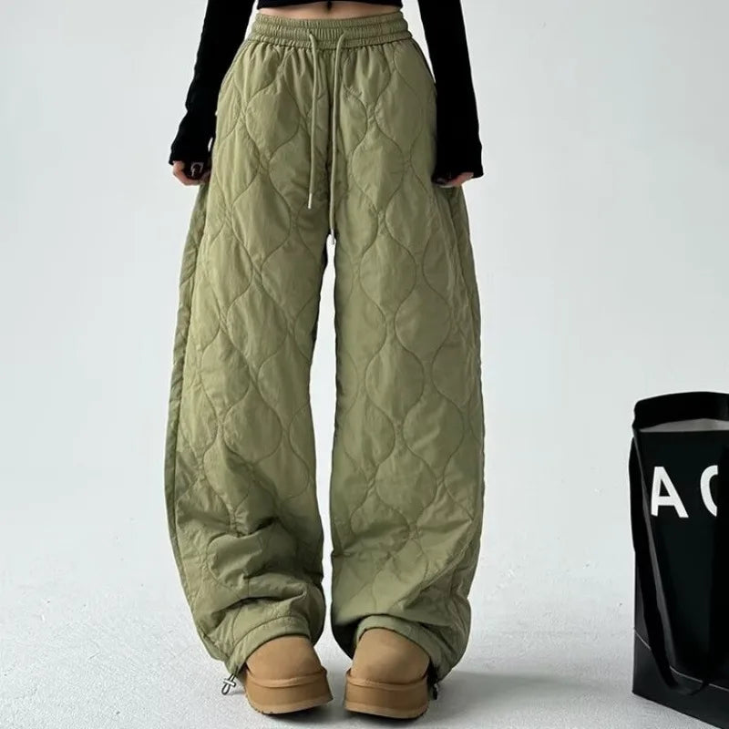 Close-up of the quilted texture on Women's Cloudline trousers, highlighting their relaxed fit & cozy feel.