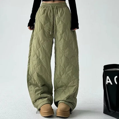 Close-up of the quilted texture on Women's Cloudline trousers, highlighting their relaxed fit & cozy feel.