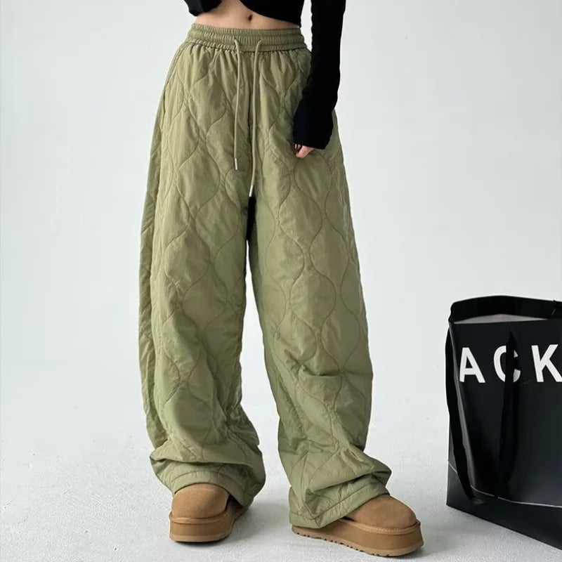Model wearing stylish Cloudline quilted wide-leg trousers, showcasing their comfortable, chic, and versatile fashion.