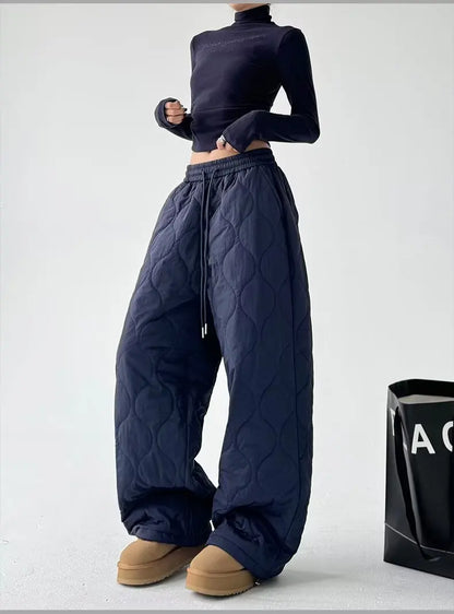 Women's cozy Cloudline quilted trousers, offering comfortable bottoms and a relaxed wide-leg for everyday versatile wear.
