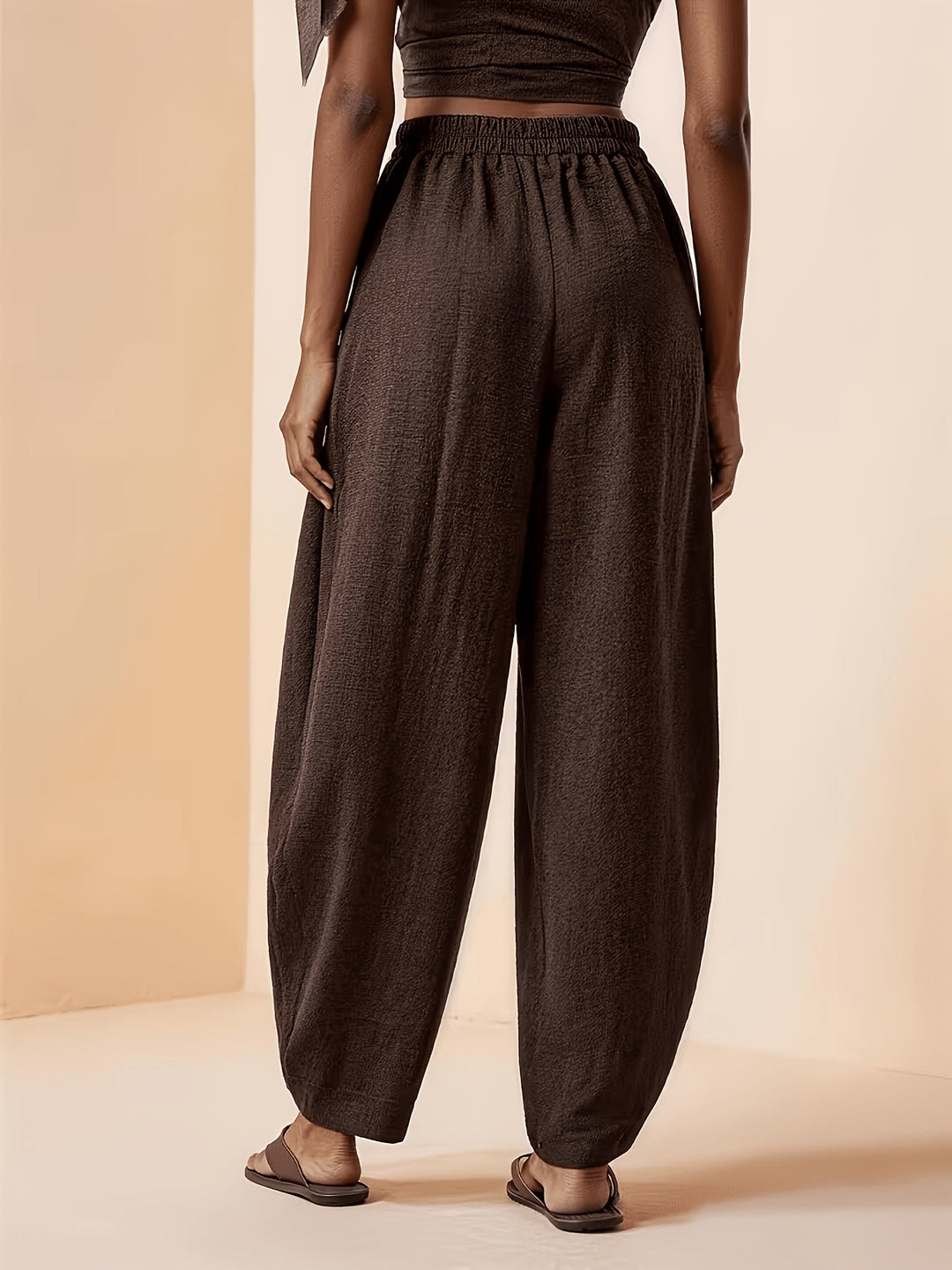 Stylish women's coffee brown relaxed fit harem pants, high waist and tapered ankle, ideal for travel or daily comfort.