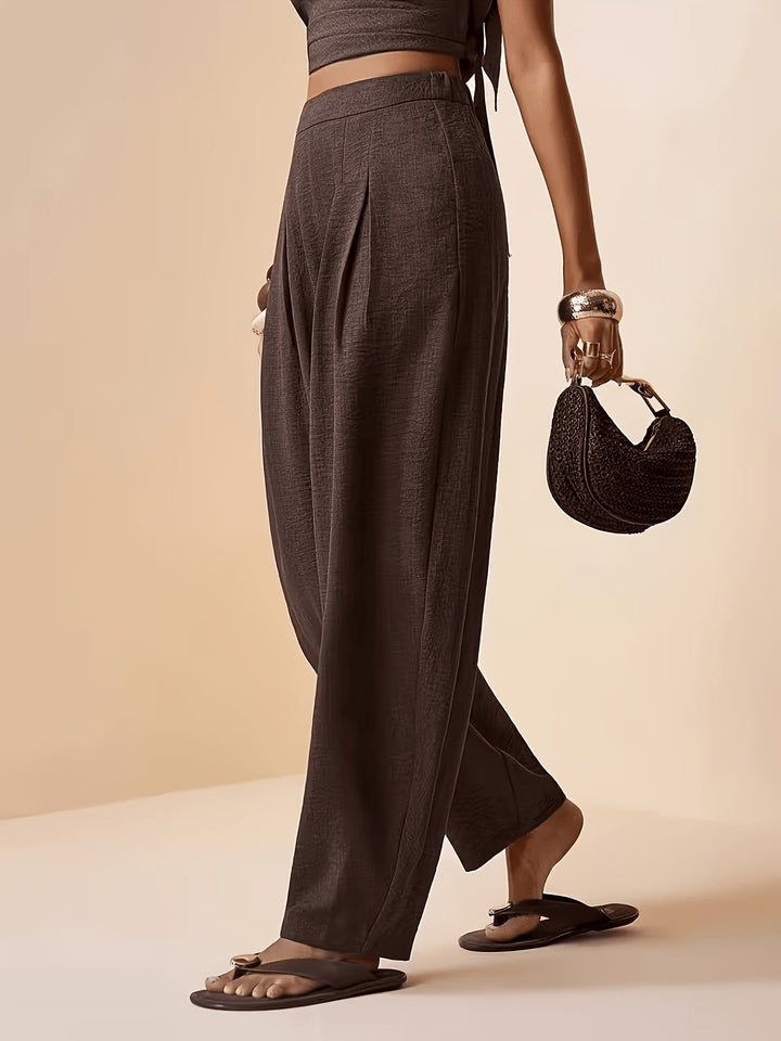 Pleated coffee brown high-waist women's harem pants, featuring a tapered ankle for a stylish and loose fit.