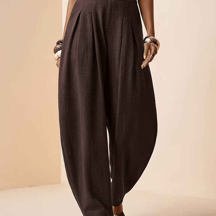 Comfortable women's coffee brown high-waisted harem pants with tapered ankles, versatile for casual or travel style.