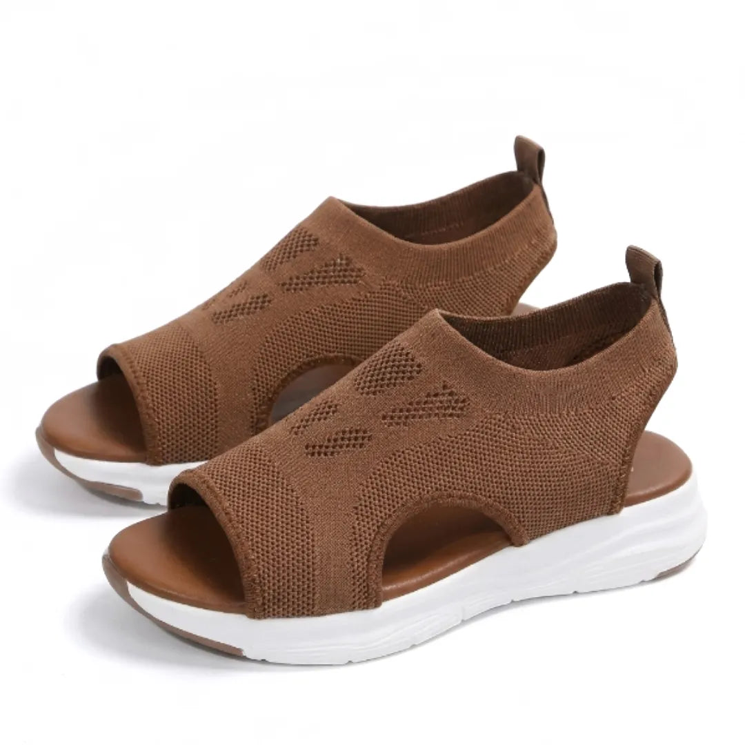 Lightweight women's walking sandals, featuring a breathable wedge and ergonomic foot support.