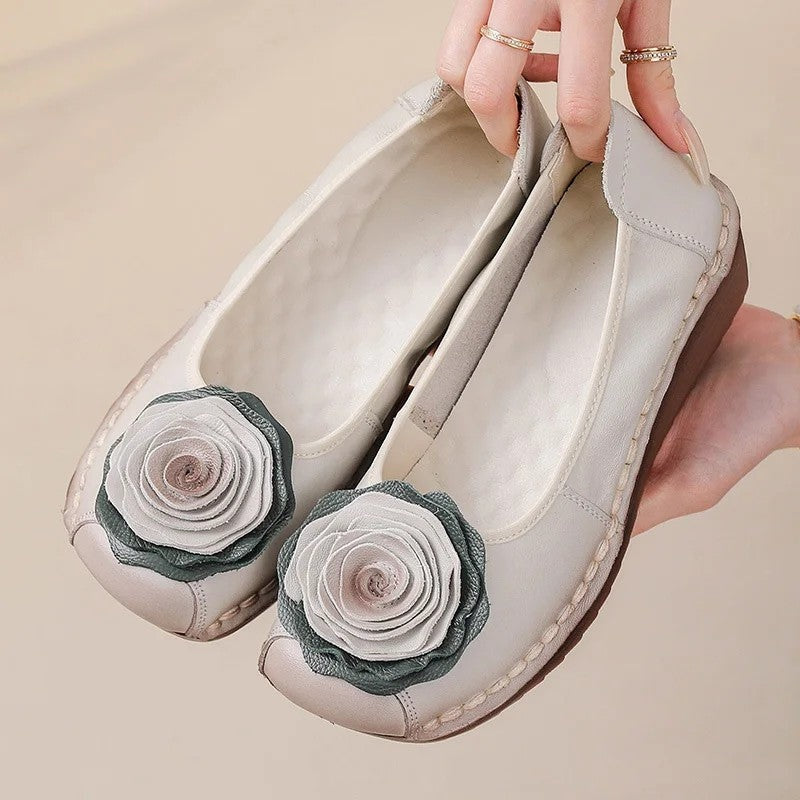 Women's comfort slip-on loafers with elegant floral appliqué, perfect for everyday stylish footwear.