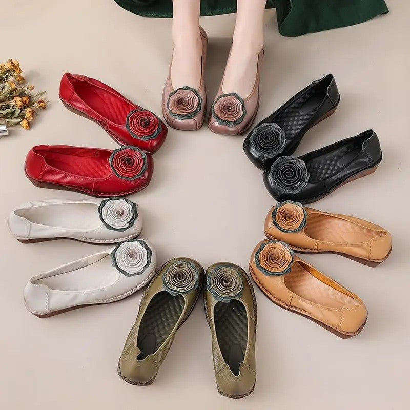 Women's fashionable footwear: comfort loafers with unique floral appliqué, perfect for a chic casual look.