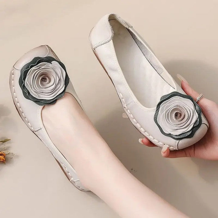 Fashionable women's loafers, ideal for casual wear, showcasing delicate floral appliqué and easy slip-on design.