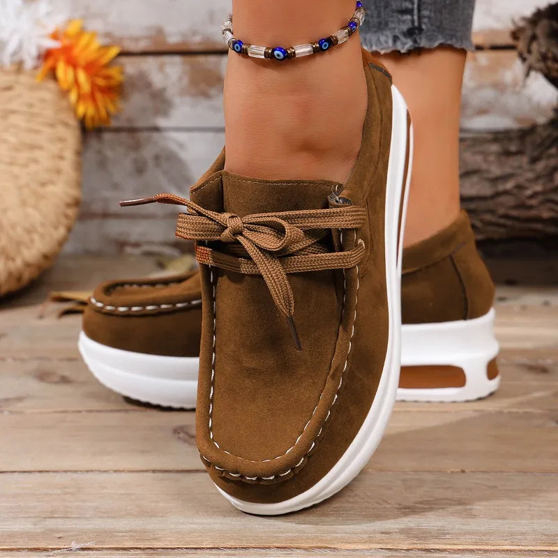 Women's casual comfort walkers, featuring a cushioned platform and secure lace-up fit.