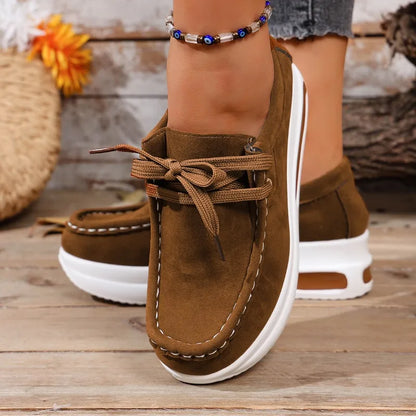 Women's casual comfort walkers, featuring a cushioned platform and secure lace-up fit.
