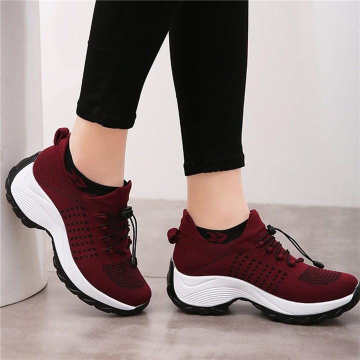 Women's comfort walking shoes, black, with strong arch support for daily activities.