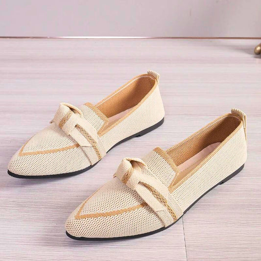 Women's comfortable ballet flats with stylish twisted toe detail and arch support for everyday wear.