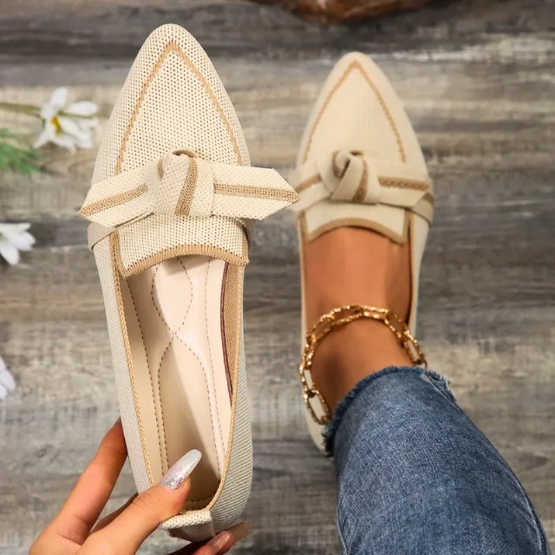 Elegant women's slip-on ballet flats featuring a unique twisted toe design for casual or formal outfits.