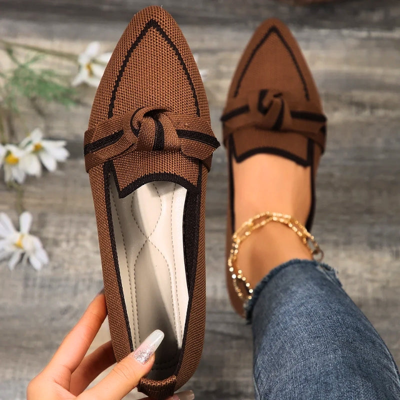 Elegant women's footwear: comfortable ballet flats with arch support and a unique twisted toe detail.