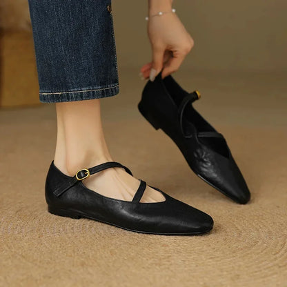 Slip-resistant women's flats with adjustable strap, closed toe. Comfortable, versatile footwear.