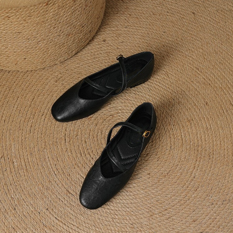 Closed-toe women's flats featuring an adjustable strap, designed for ultimate comfort & everyday style.