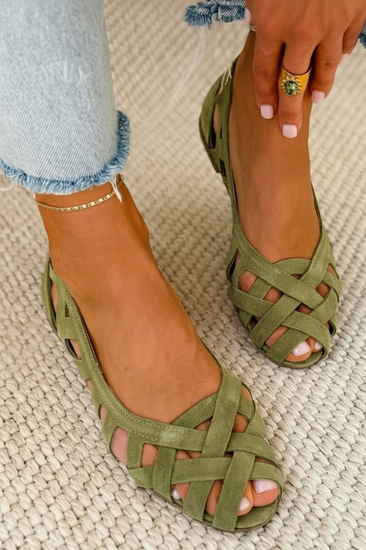 Comfortable women's slip-on sandals with soft braided crossover straps, great for everyday summer wear.