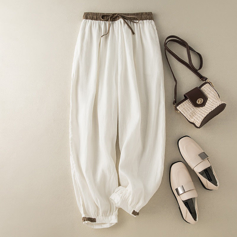 Beige women's cuffed harem pants, offering relaxed comfort and versatile style for casual or everyday wear.