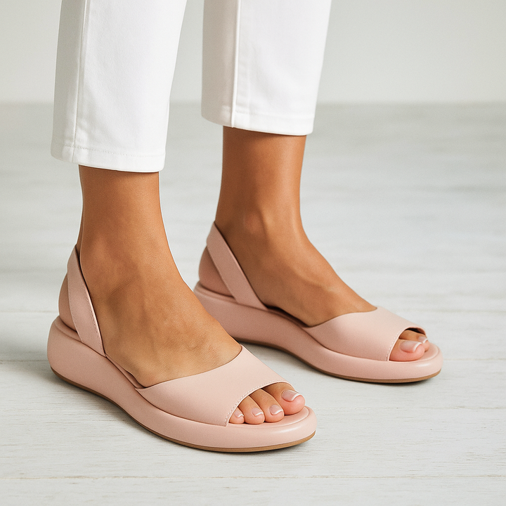 Stylish women's slip-on flat sandals, perfect lightweight summer footwear.