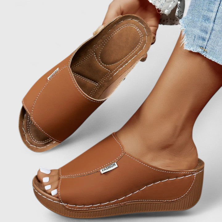 Stylish women's summer sandals for beachwear, travel, or daily casual comfort. Open-toe footwear.