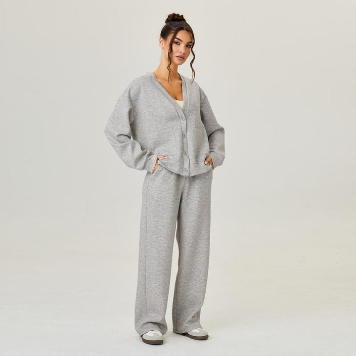 Women's comfortable knit lounge set, featuring a soft cardigan & relaxed fit trousers in a modern gray.