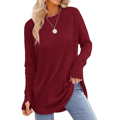 Versatile women's tunic top with long sleeves & thumbholes, pairs well with leggings.