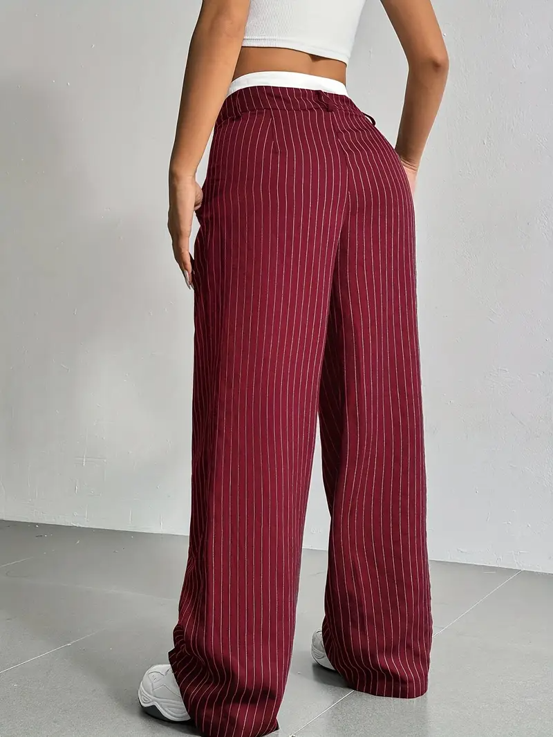 Fashionable women's wide-leg pinstripe trousers, creating an elegant and comfortable silhouette for any occasion.