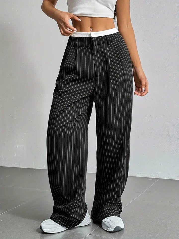 Stylish women's wide-leg pinstripe pants with an elastic waist for modern comfort and a chic silhouette.