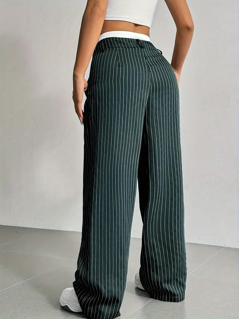 Relaxed fit women's pinstripe wide-leg pants with an elastic waist, combining comfort with modern elegance.