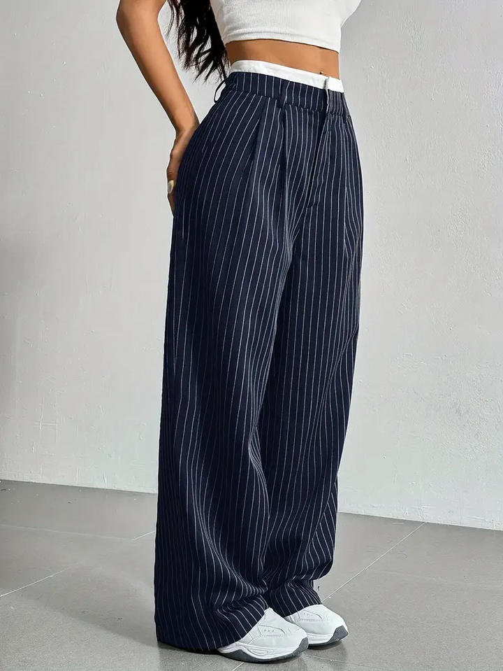Modern women's wide-leg pinstripe trousers, a stylish choice for contemporary fashion and comfortable streetwear.
