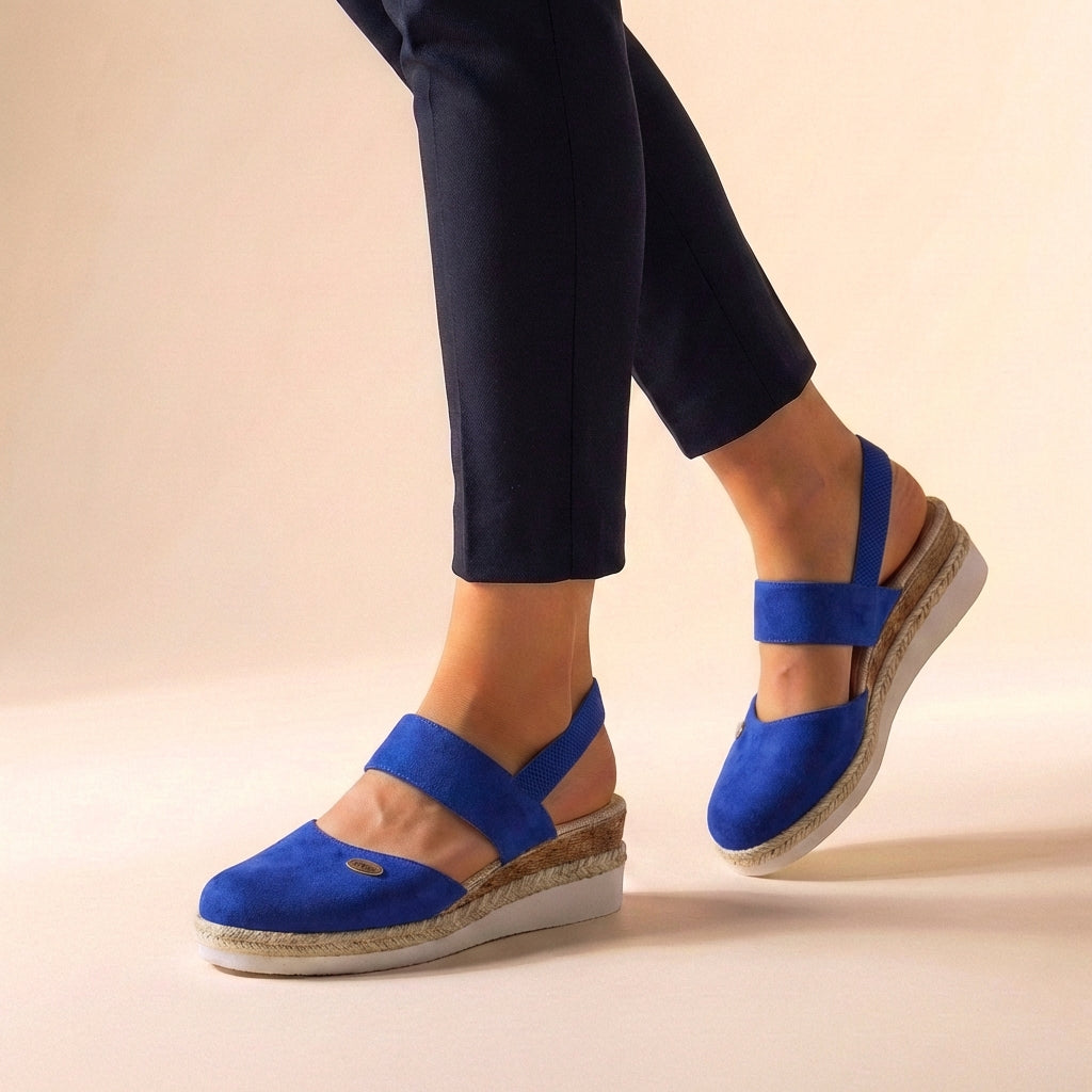 Stylish women's espadrille wedge sandals, a comfortable platform design for warm weather.