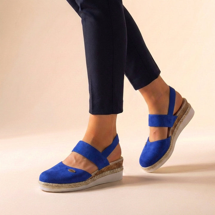 Stylish women's espadrille wedge sandals, a comfortable platform design for warm weather.