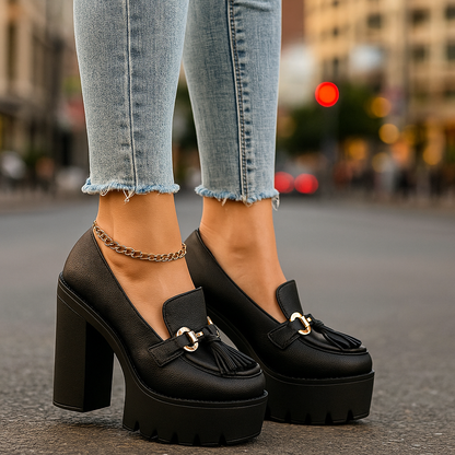 Chic women's platform loafers with a striking gold buckle, ideal for fashionable comfort.