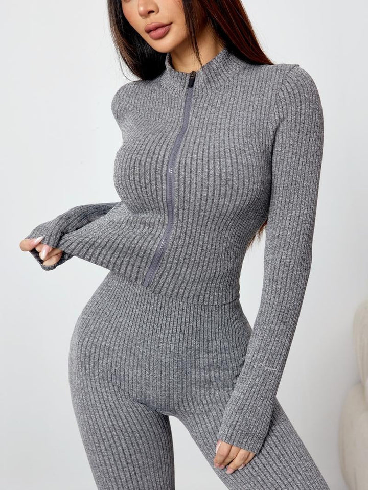 Full view of women's stretchy ribbed knit loungewear set; includes a long sleeve top & fashionable flare pants.
