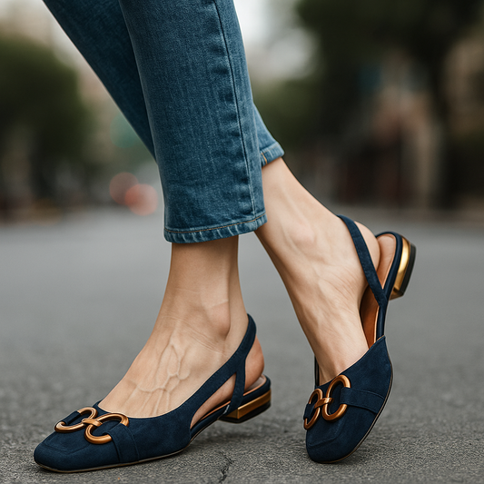 Women's comfortable slingback flats with elegant gold-tone chain detail for everyday wear.