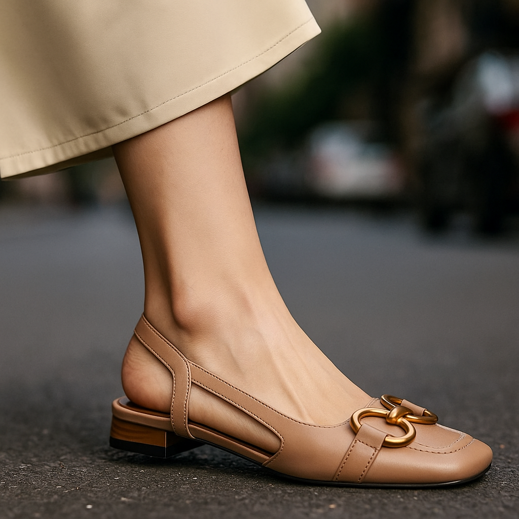Comfortable women's footwear: slip-on slingback flats with eye-catching gold-tone chain.