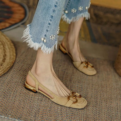 Chic women's work shoes: comfortable slingback flats with a dazzling gold-tone chain accent.