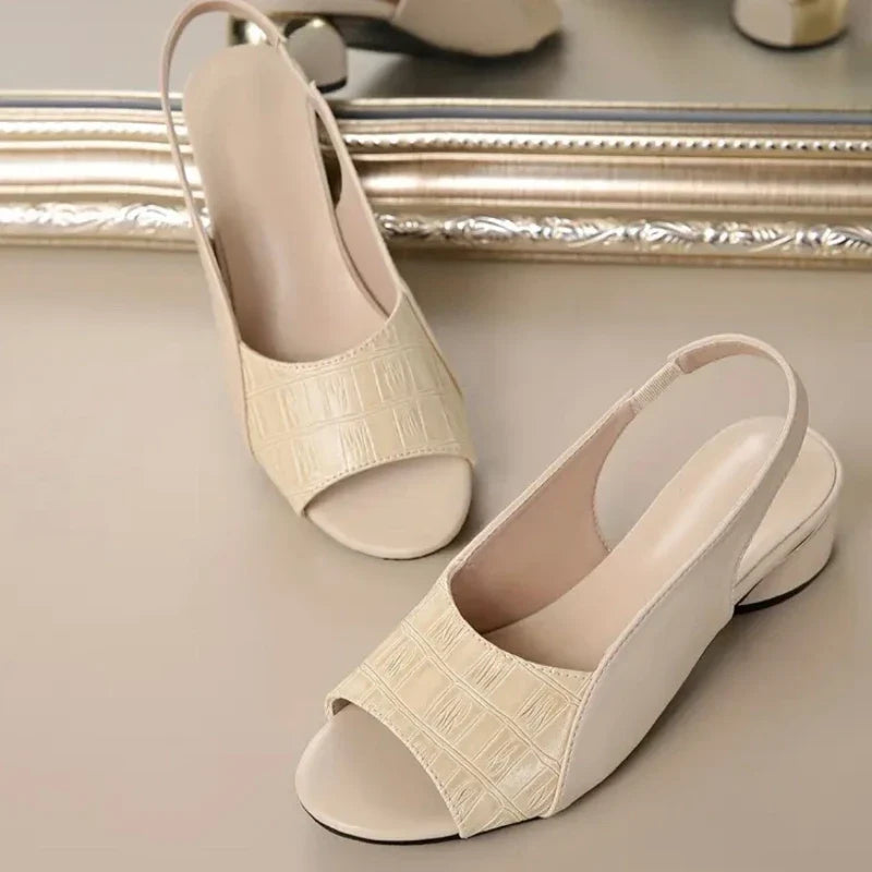 Casual yet chic women's slingback slip-on sandals, comfortable low heel & fashionable croc texture.