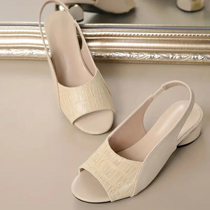 Casual yet chic women's slingback slip-on sandals, comfortable low heel & fashionable croc texture.