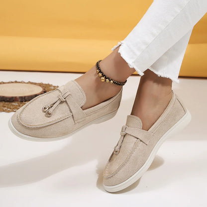 Chic ladies' slip-on loafers, cushioned footbed for ultimate comfort, in a versatile neutral color.