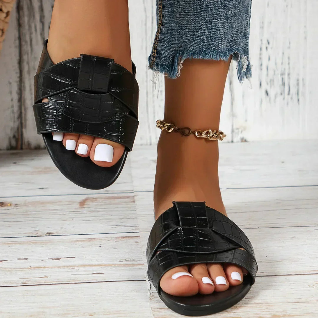 Stylish open-toe flat women's slide sandals for casual everyday wear & summer comfort.