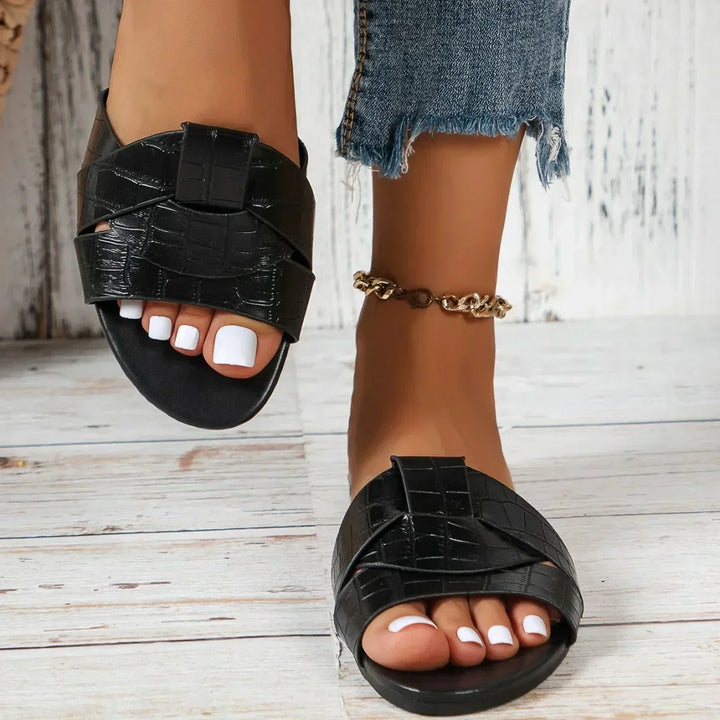 Stylish open-toe flat women's slide sandals for casual everyday wear & summer comfort.