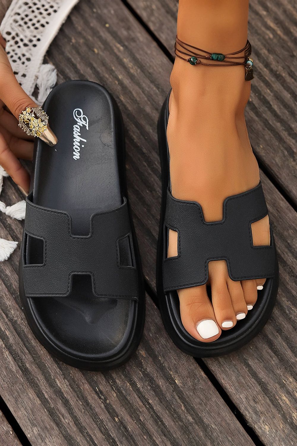 Stylish open-toe women's sandals with soft cushioning, ideal for summer comfort. Easy slip-on design.