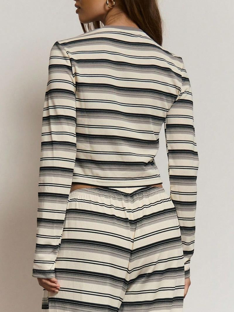 Detail shot of women's striped knit lounge set. Soft fabric texture and stylish pattern of this cozy outfit.