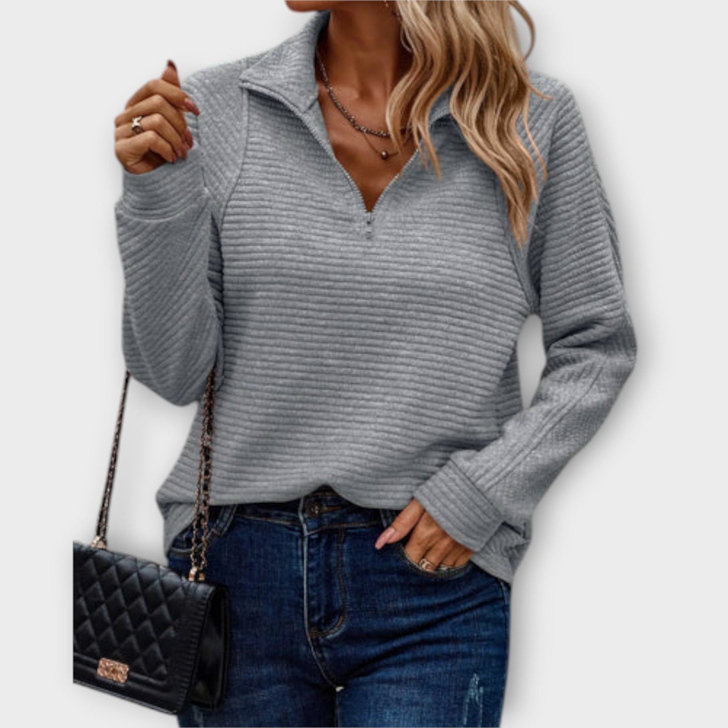 Soft knit women's V-neck sweater. Stylish & comfortable long sleeve pullover, ideal for everyday elegance.