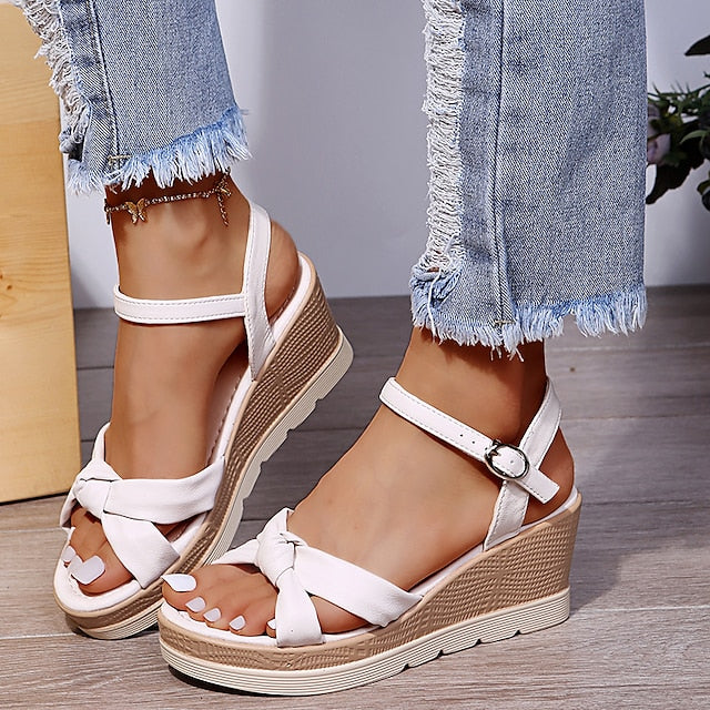 Women's comfortable white platform wedge sandals with ankle strap, perfect for summer chic.